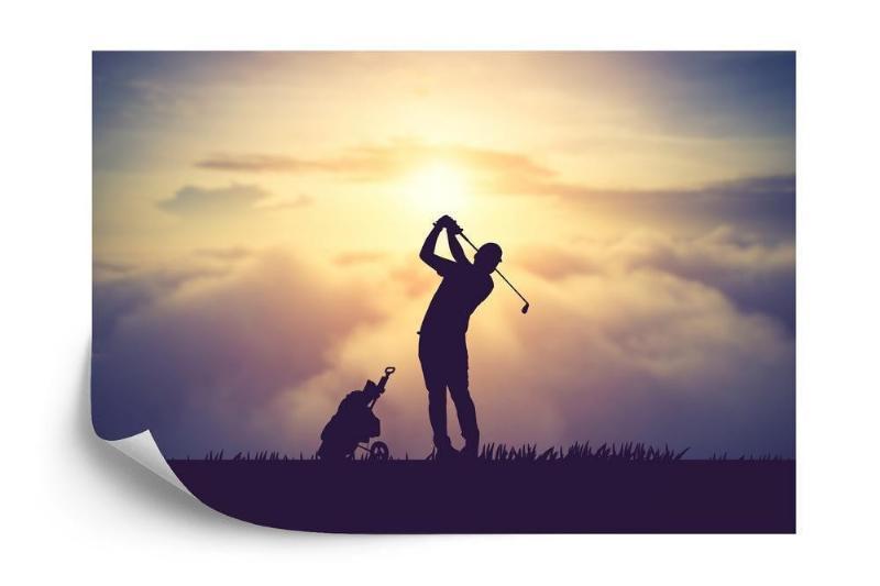 Fototapet - Golfspiller ved solnedgang